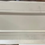 Kunststoffverkleidung hinten links am Bett beige